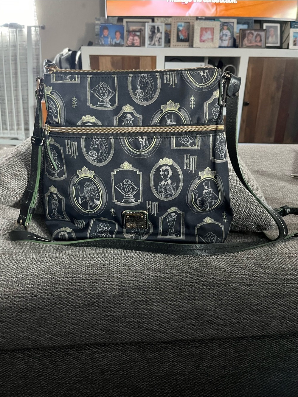 Like new Dooney & Bourke Black Crossbody Bag with Disney Haunted Mansion Motif